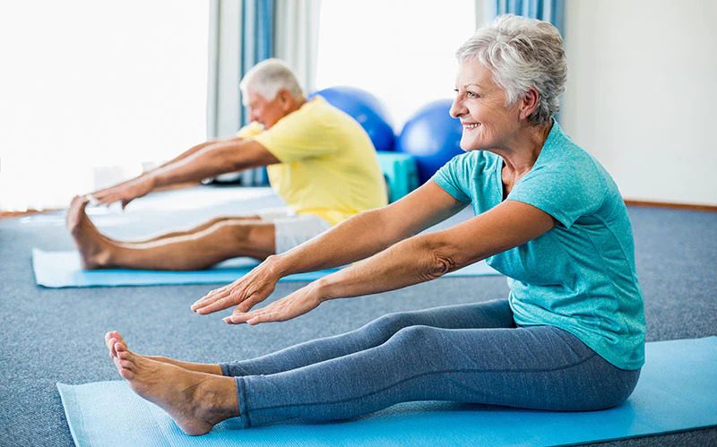 Elderly couple stretching