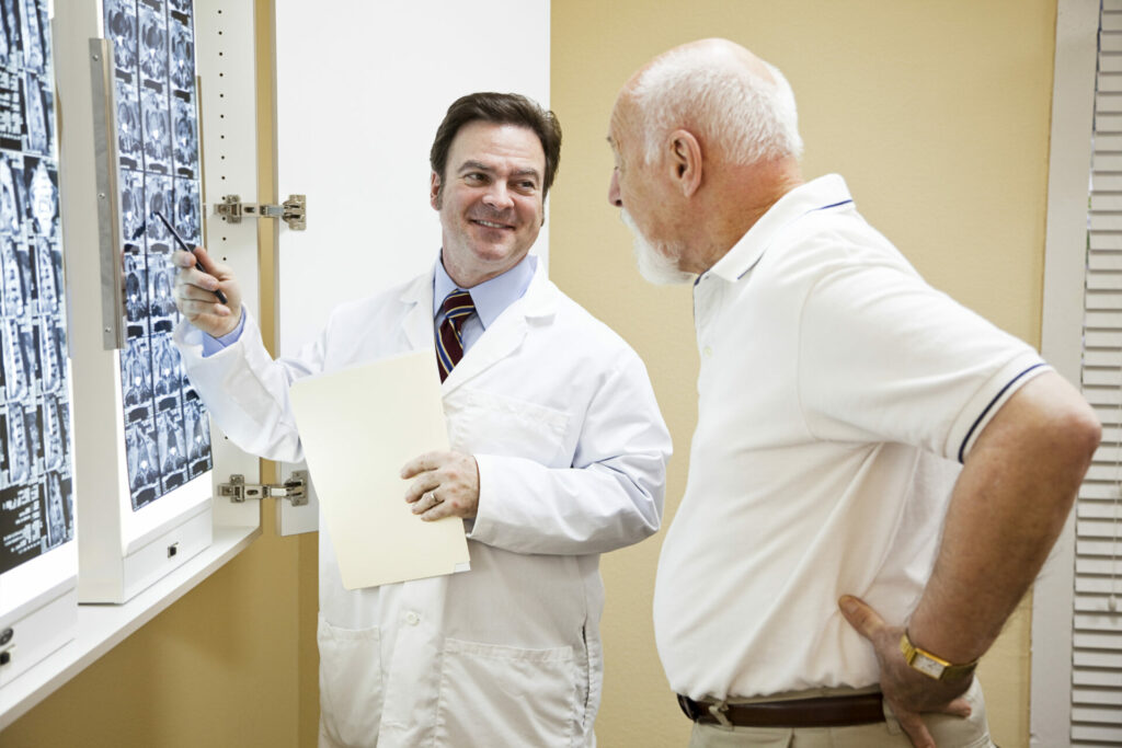 doctor explaining CT scan to patient