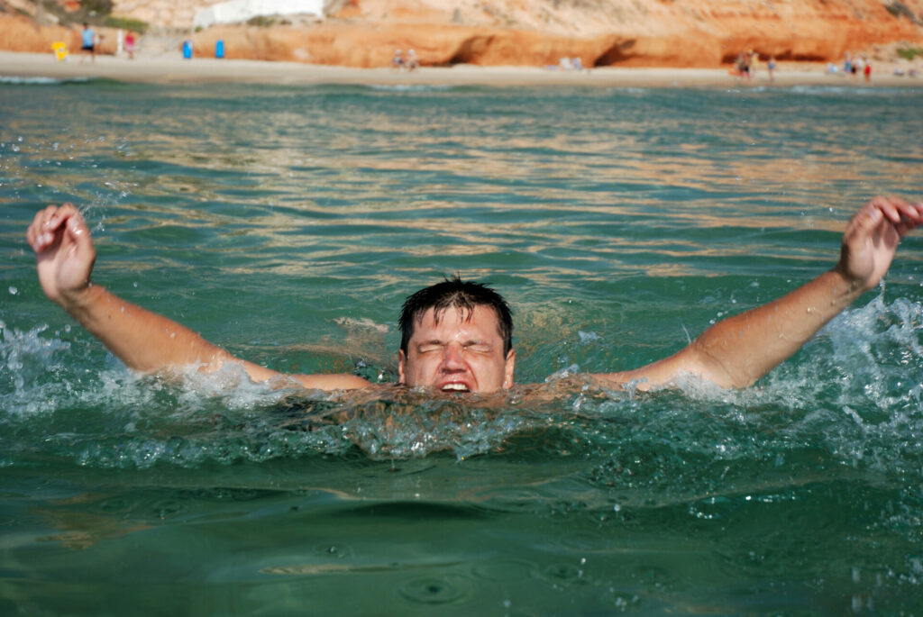 man drowning off the beach