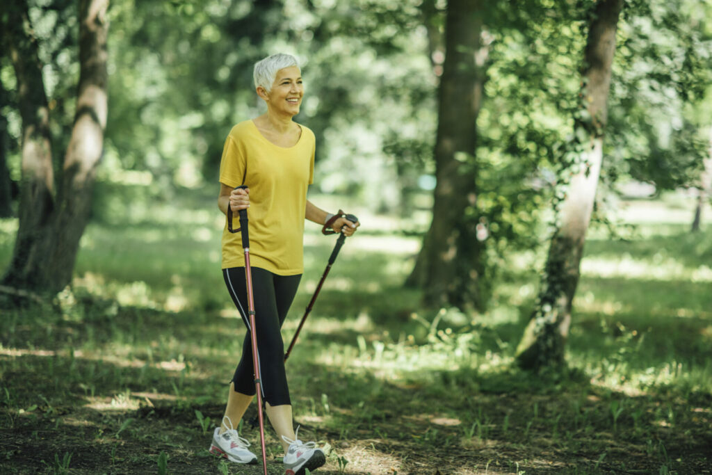 older woman out Nordic walking