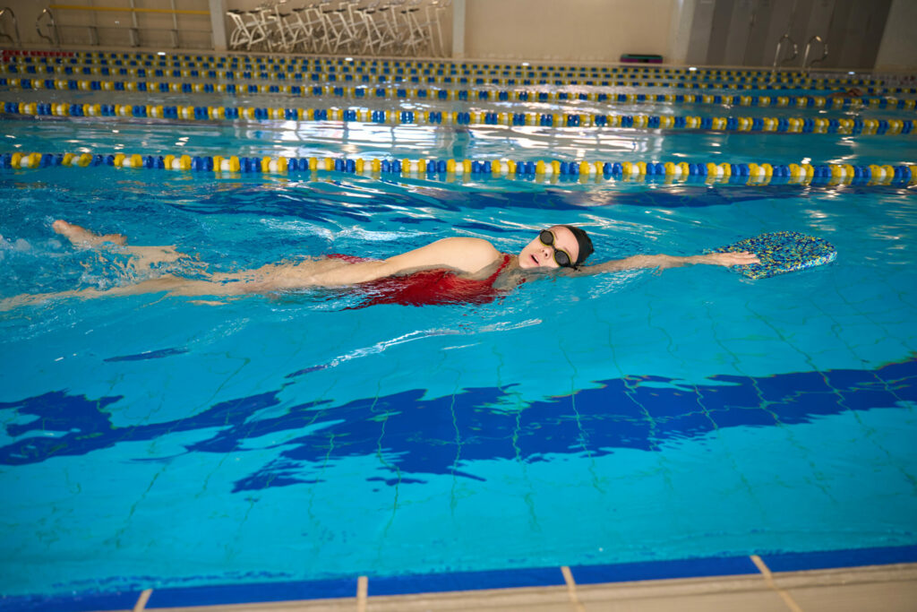 person swimming in pool