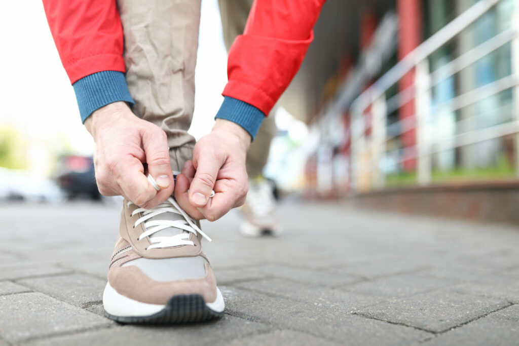 person tying their shoe