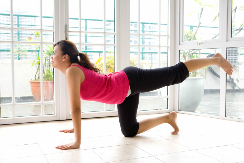 woman practicing yoga