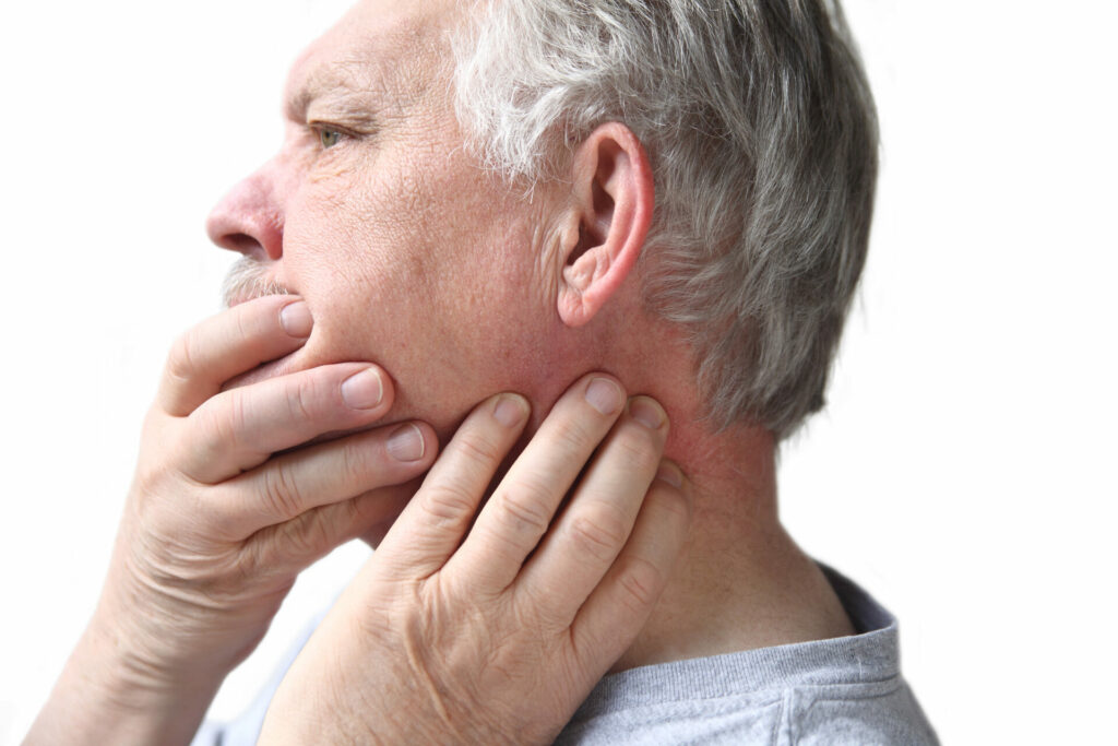 Senior with a stiff neck and jaw