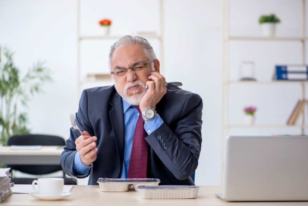 man trying to eat at work